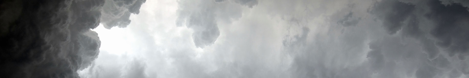 Storm clouds ranging in darkness and contrast from left to right.